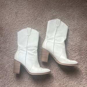 Gently worn white cowboy boots